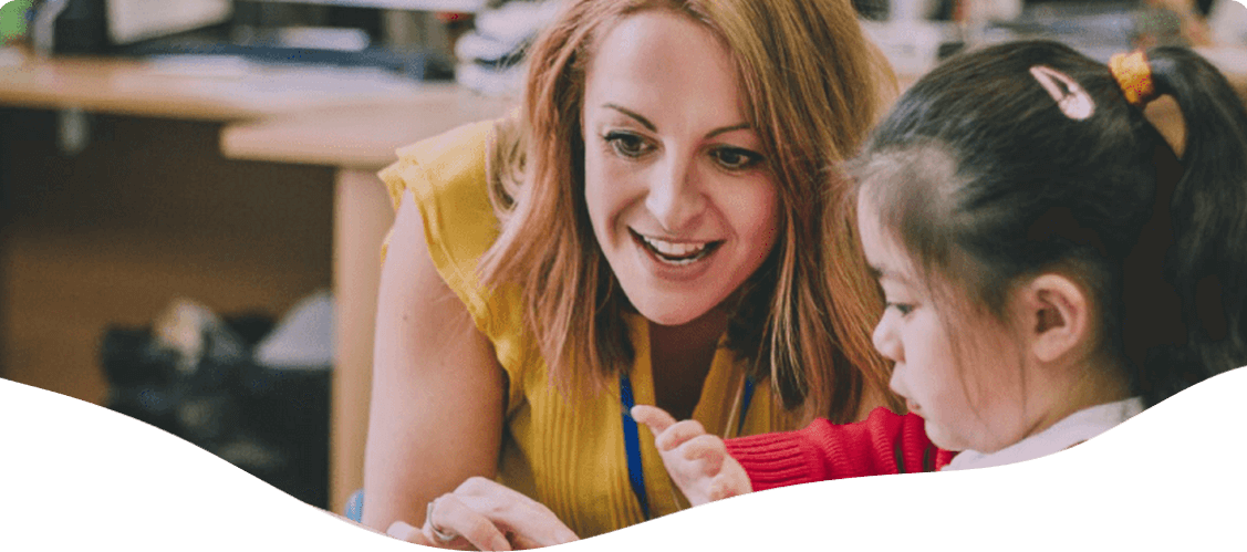 Teacher assisting her student — Blog in Ashmore, QLD