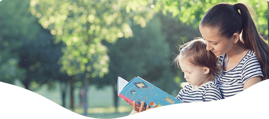 Woman reading book for a kid — Blog in Ashmore, QLD