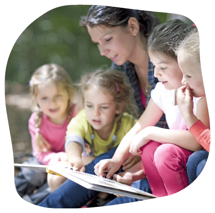 Kindergarten Teacher Reading With Kids