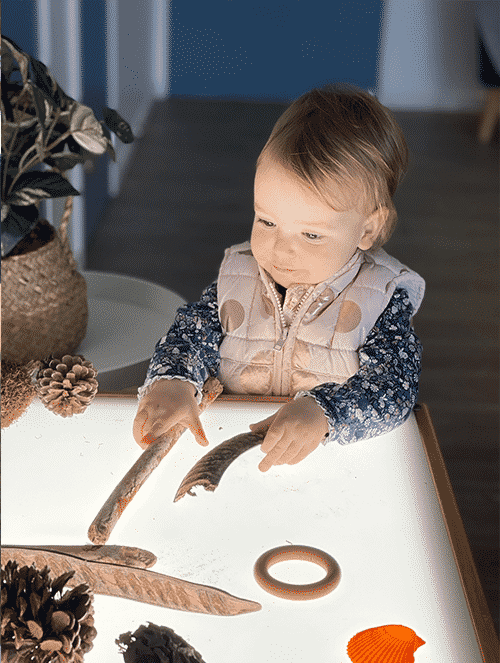 Baby Girl Playing With Woods — Early Learning Centre in Mermaid Waters, QLD