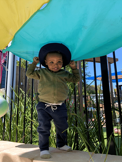 Little Boy Hiding Under Tent — Early Learning Centre Ashmore,QLD
