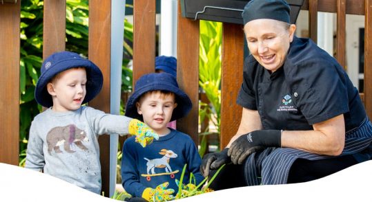 A Woman Helping To Two Kid Helping Water And Garden — Early Learning Centre Maudsland,QLD