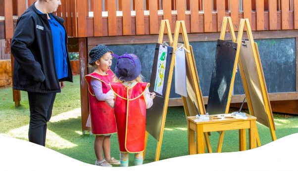 A Teacher And Two Kids Drawing — Early Learning Centre Maudsland,QLD