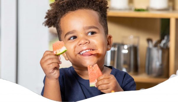 A Little Boy Eating Slice Watermelon — Early Learning Centre Maudsland,QLD