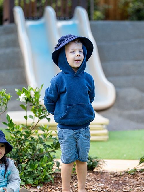 Young Boy Wearing Blue Jacket — Early Learning Centre in Ashmore, QLD