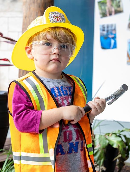 Young Boy Wearing Construction Gear — Early Learning Centre in Ashmore, QLD