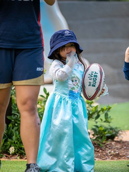 Little Girl Wearing a Gown and Holding a Ball — Early Learning Centre in Ashmore, QLD