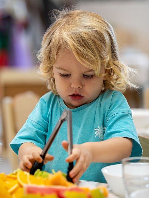 Little Girl Wearing Sky Blue T-shirt — Early Learning Centre in Ashmore, QLD