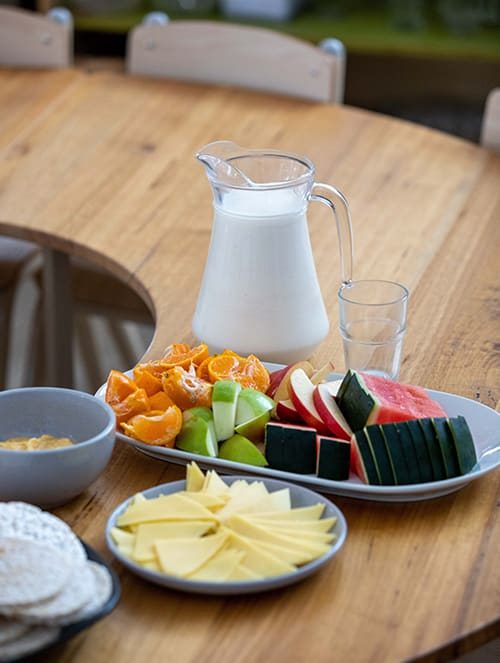 Food and milk in the table — Early Learning Centre in Buderim, QLD