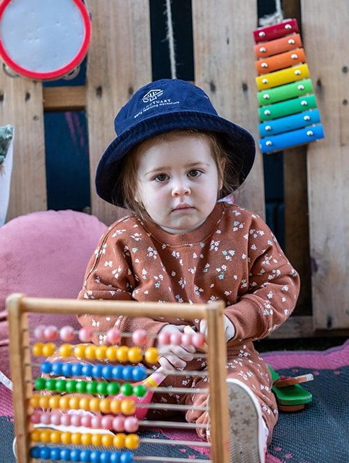 Girl doing abacus math — Early Learning Centre in Buderim, QLD