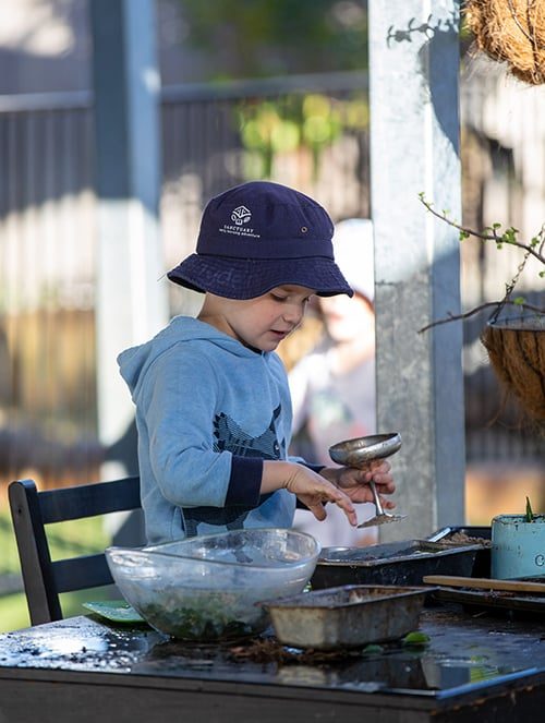 Boy preparing in the backyard — Early Learning Centre in Buderim, QLD