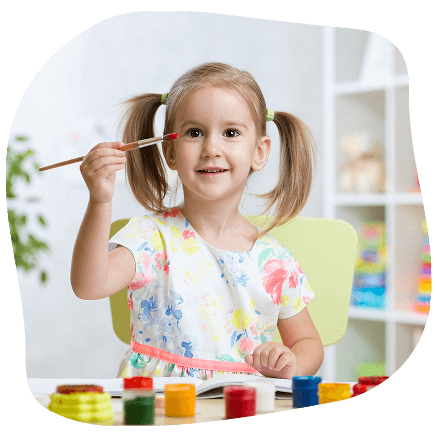 Girl with paint brush — Early Learning Centre in Ashmore, QLD