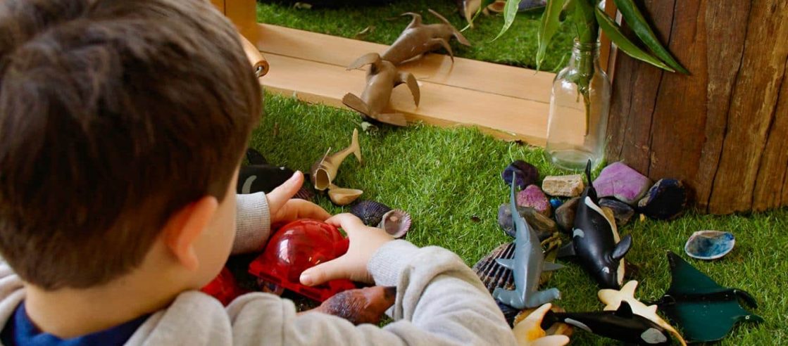 Young Boy Happily Playing with Toys on The Floor — Early Learning Centre Maudsland,QLD
