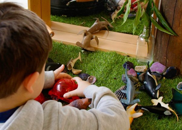 Young Boy Happily Playing with Toys on The Floor — Early Learning Centre Maudsland,QLD